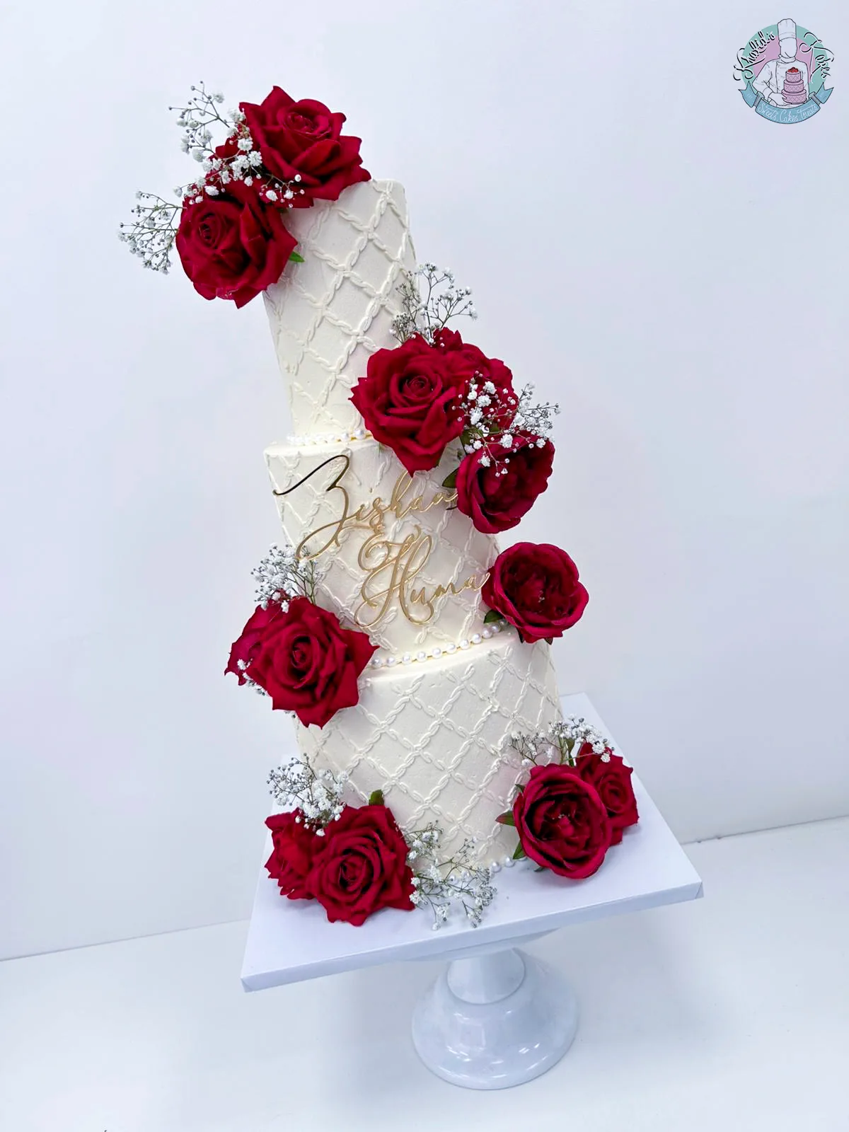 Quilted Stencil Wedding Cake Birmingham — tiered cake with quilted stencil detailing, extra florals and metallic leaf accents.