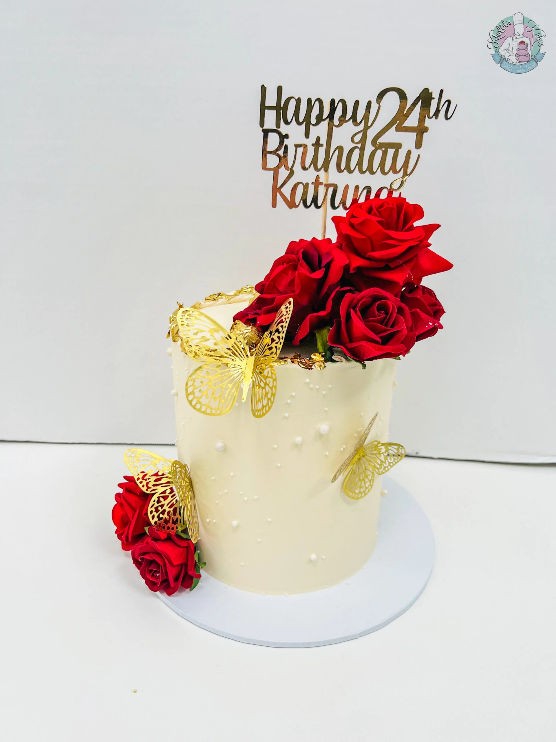 Pearl Cake Birmingham, an elegant cake decorated with pearls and coloured flowers, handmade by Khalids Kakes