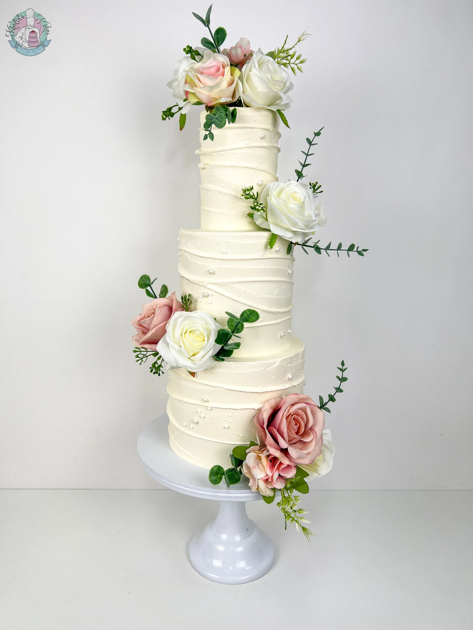 Wave Wedding Cake Birmingham — tiered cake with a fluid sculpted wave design and personalised detailing.