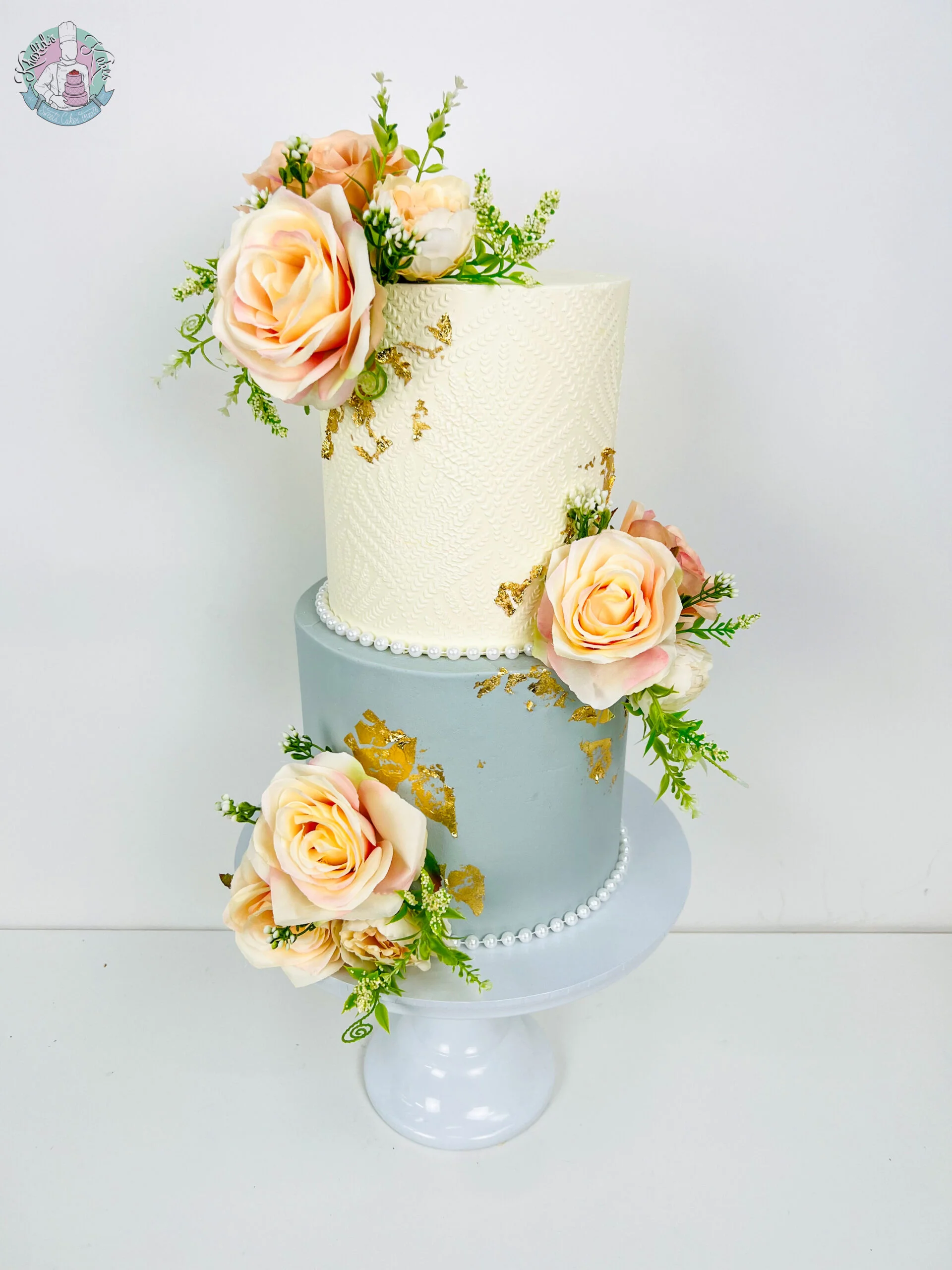 Colour Stencil Wedding Cake Birmingham — vibrant tiered cake with bold colours, stencil detailing and metallic leaf accents.