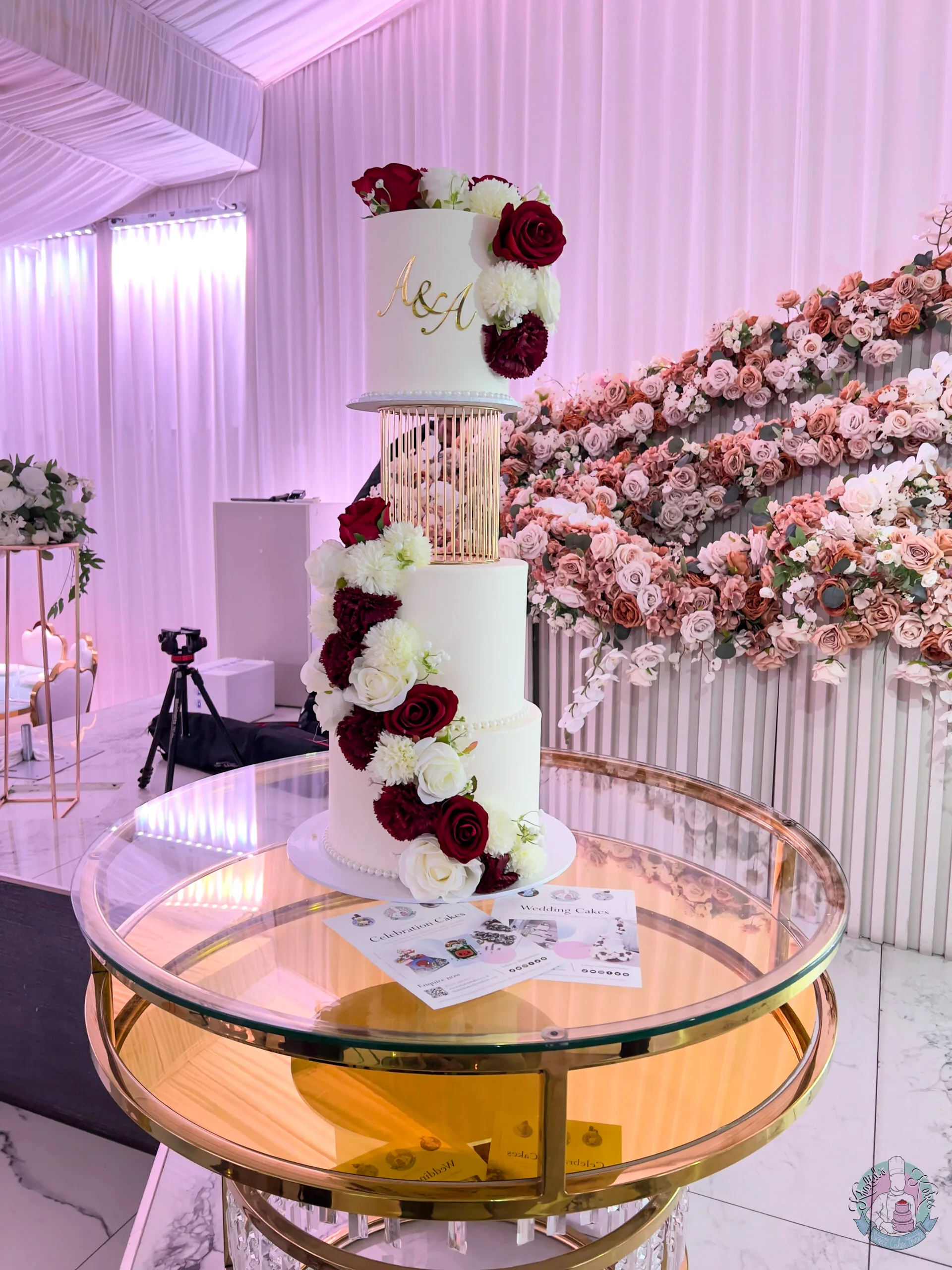 Cage Wedding Cake Birmingham, an elegant tiered cake with caged detailing and flowers, handmade by Khalids Kakes