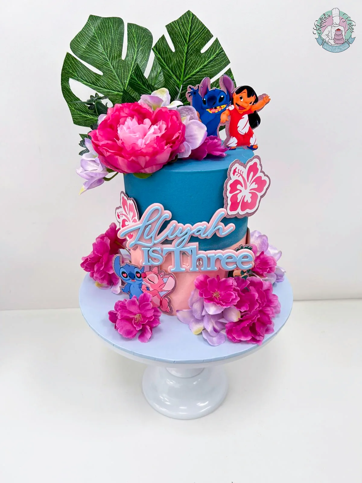 Stitch Cake Birmingham — children’s birthday cake with cheeky blue Stitch and tropical flowers.
