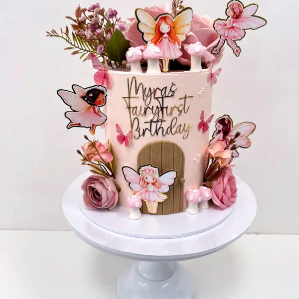 Shop 322 Fairy Cake 2 Birmingham — pink fairy-themed birthday cake with toadstools, fairy door, floral and butterfly details, handmade by Khalid's Kakes