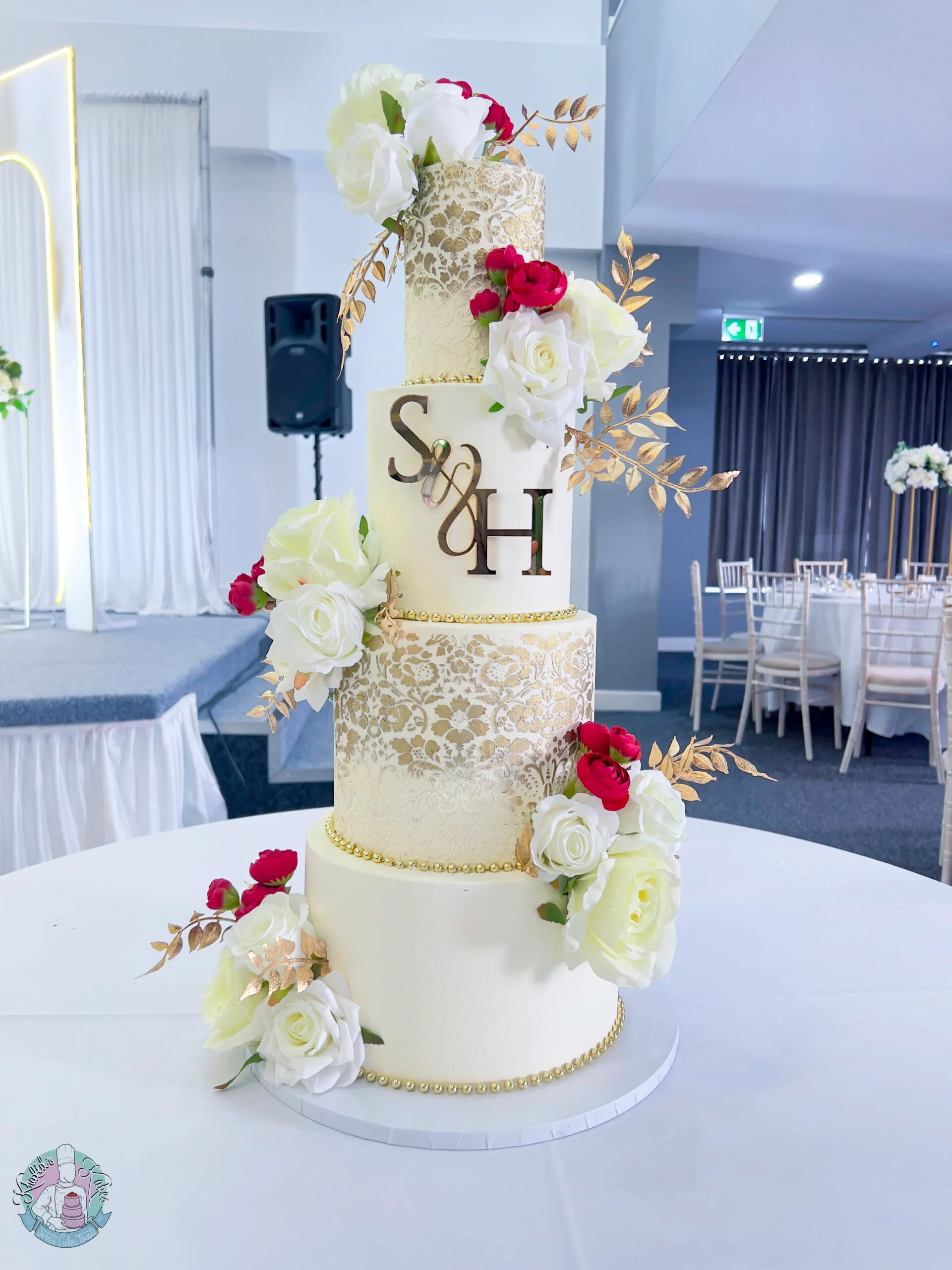 Gold Stencil Wedding Cake Birmingham — tiered cake with intricate gold stencil detailing and metallic leaf accents.