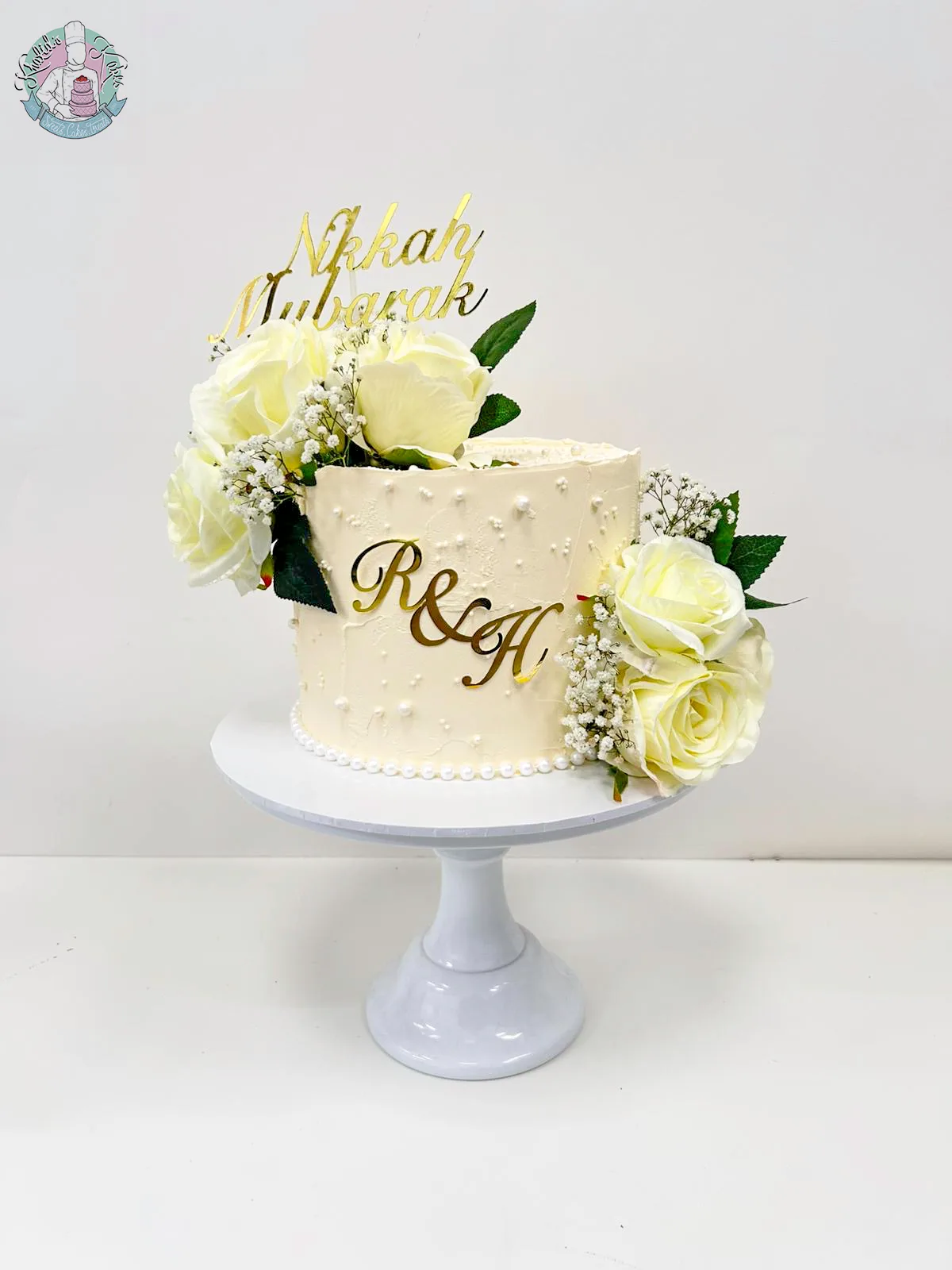 Pearl Cake Birmingham, an elegant cake with pearls and silk flowers, handmade by Khalids Kakes