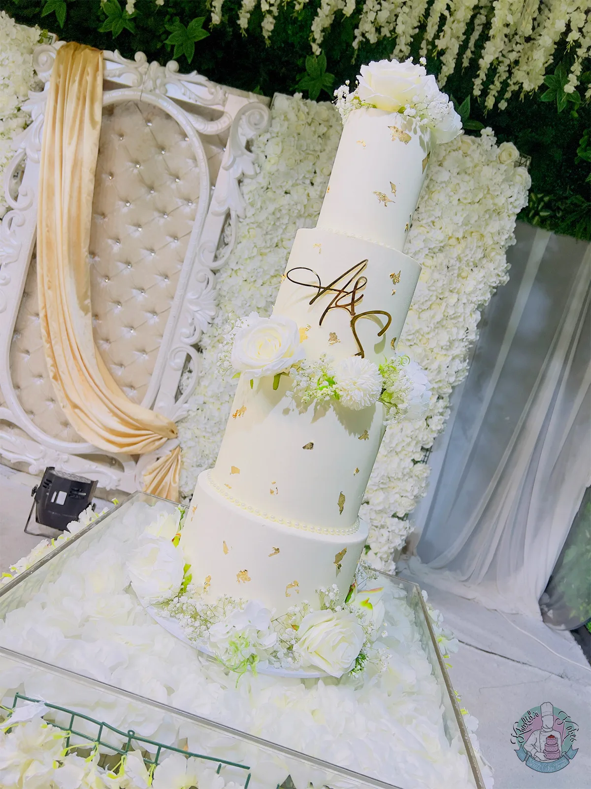 White Wedding Cake Birmingham — classic white tiered cake with a pearl ribbon and custom topper.