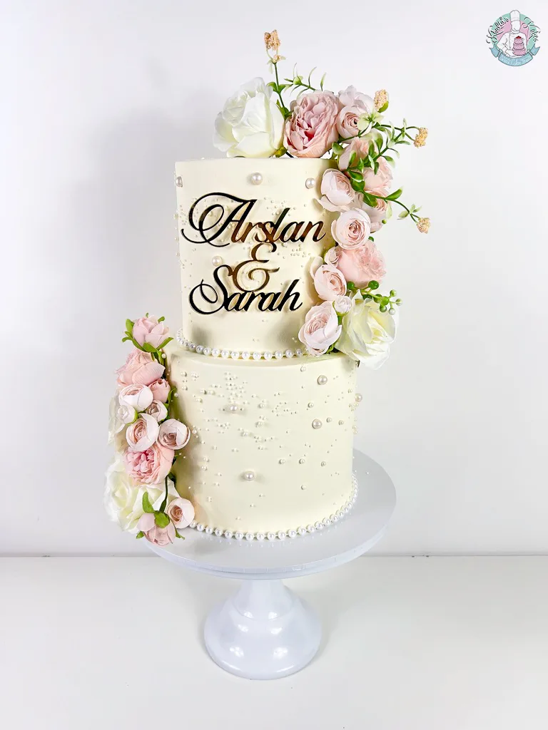 Pearl Wedding Cake 2 Birmingham — tiered cake with soft pearl detailing and flower colour accents.