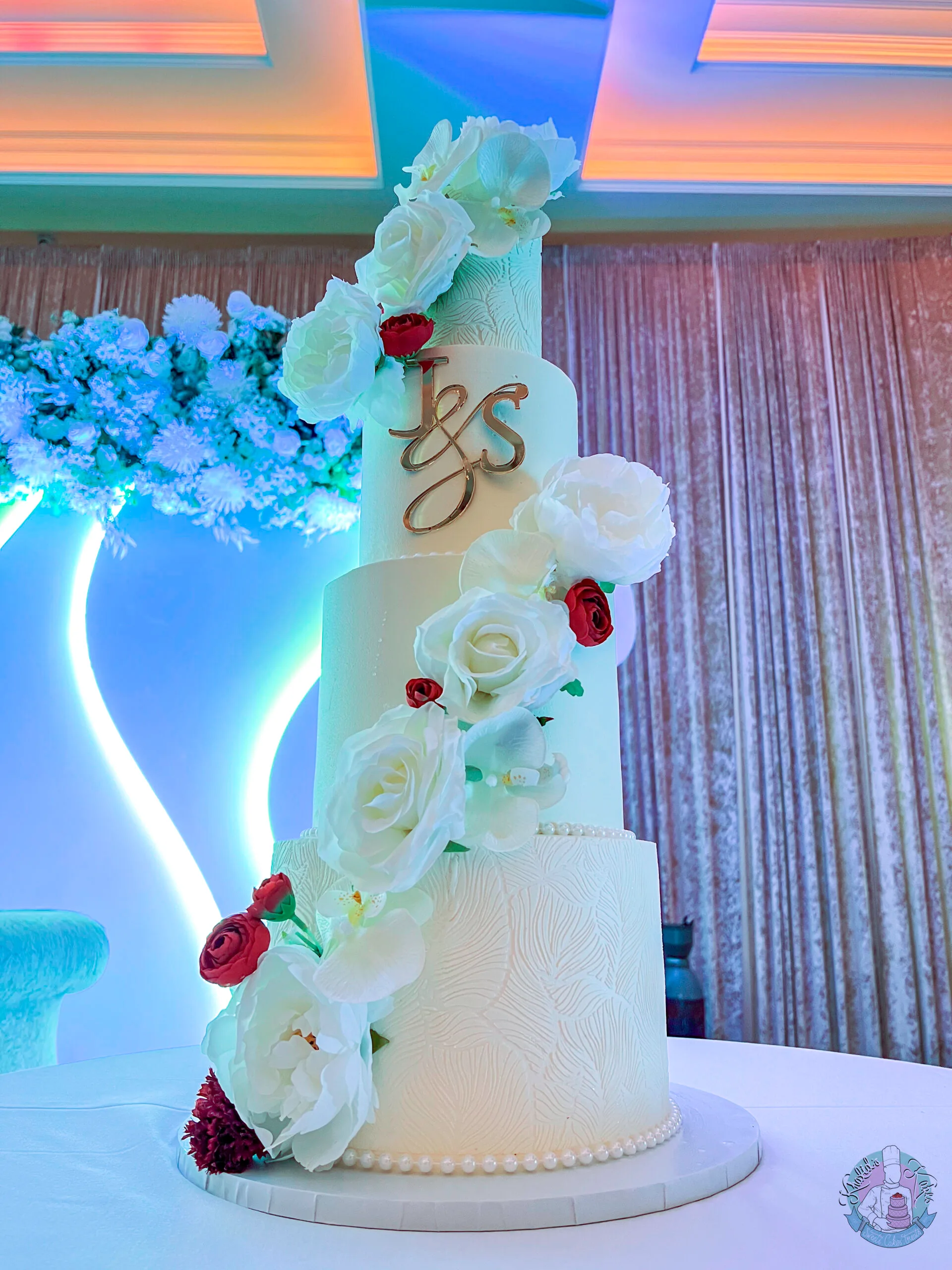 Cascade Stencil Wedding Cake Birmingham — tiered cake with cascading stencil detailing and metallic leaf accents.