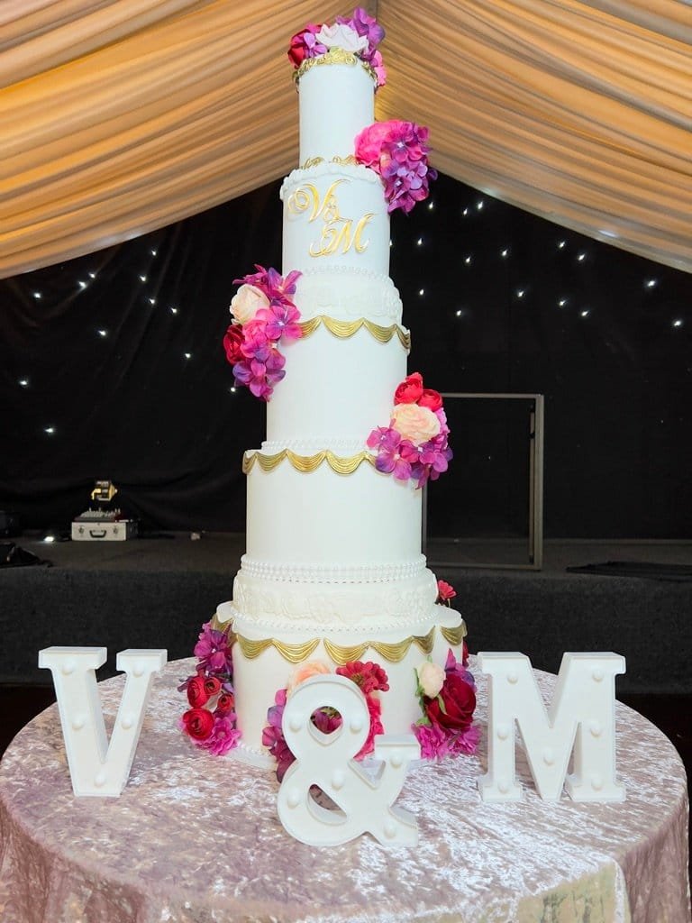 Summer Wedding Cakes: Fondant vs Buttercream — And Why It Doesn't Matter With Khalid's Kakes 1 summer wedding cake buttercream Birmingham — 5 tier fondant wedding cake gold detailing and florals by Khalids Kakes