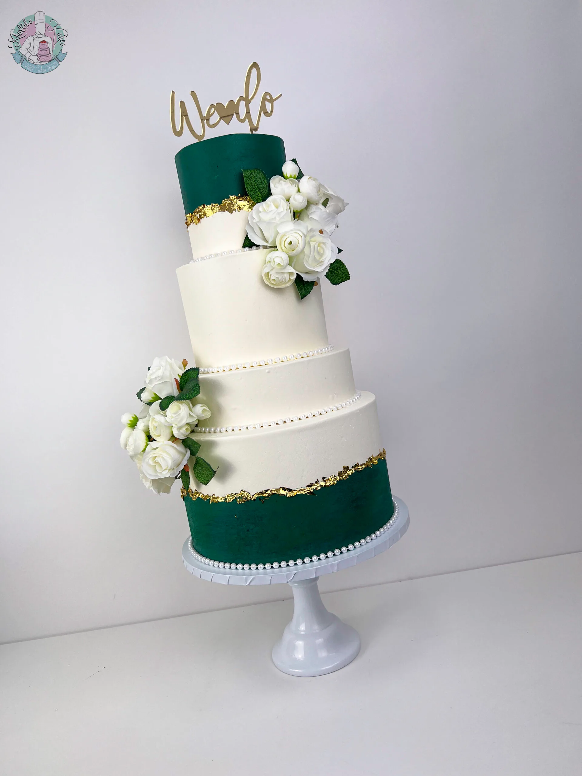 Emerald Green Wedding Cake Birmingham — bold green tiered cake with short and tall tiers and a gold leaf fault line.
