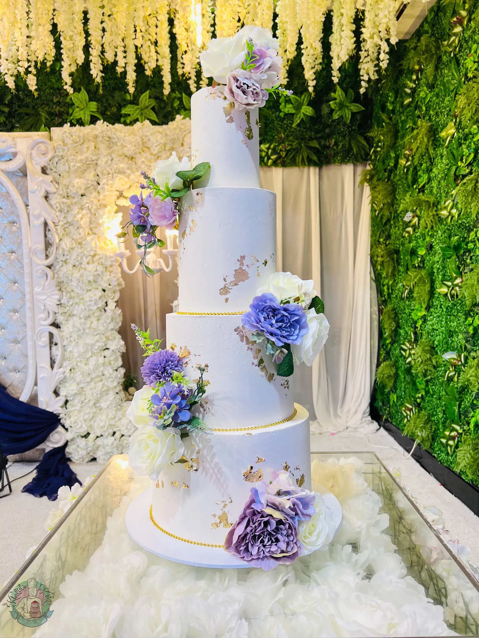 Smooth White Wedding Cake Birmingham — clean smooth white tiered cake with a pearl ribbon and custom topper.
