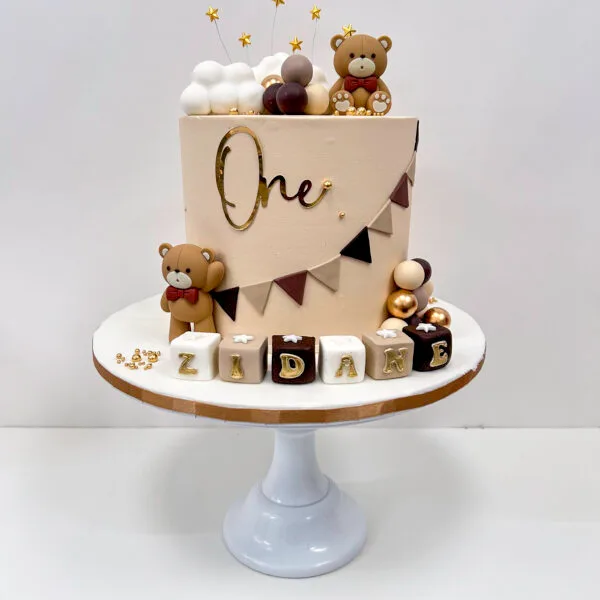 Shop 239 Teddy bear cake 3 Birmingham with sugar crafted decorations and non-edible teddies on vanilla buttercream, handmade by Khalid's Kakes