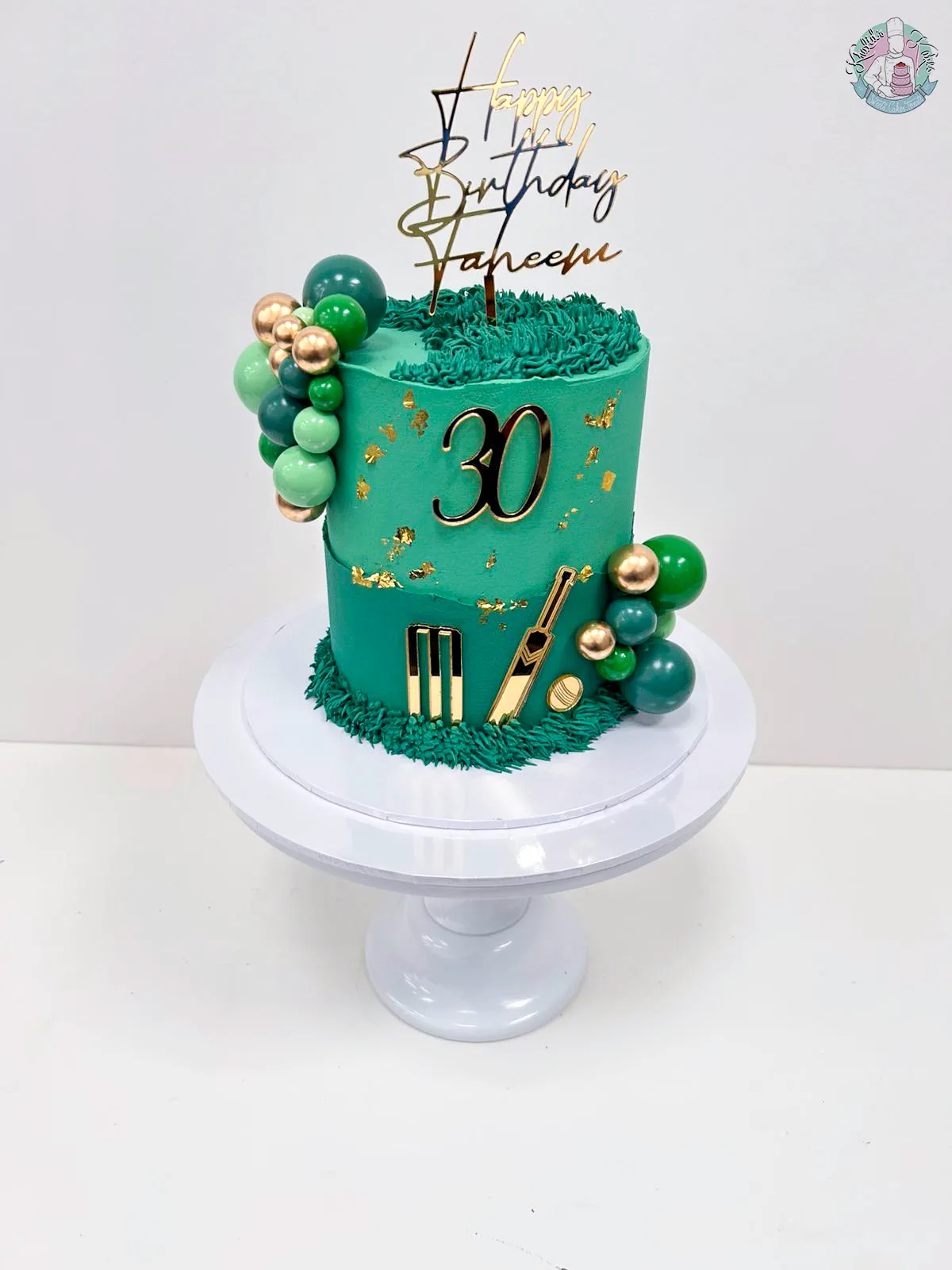 Cricket Cake handmade in birmingham with buttercream pipping, non-edible balls and acrylic charms