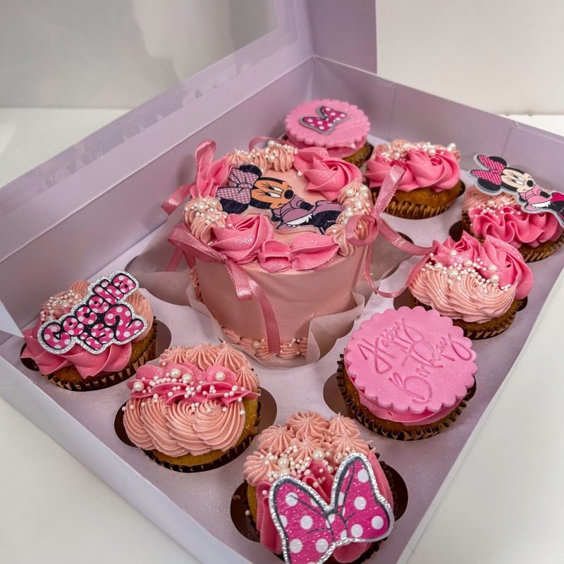 Minnie Mouse Bento Cake Birmingham — pink bento cake box with matching cupcakes, butterfly toppers and polka dot details, handmade by Khalid's Kakes
