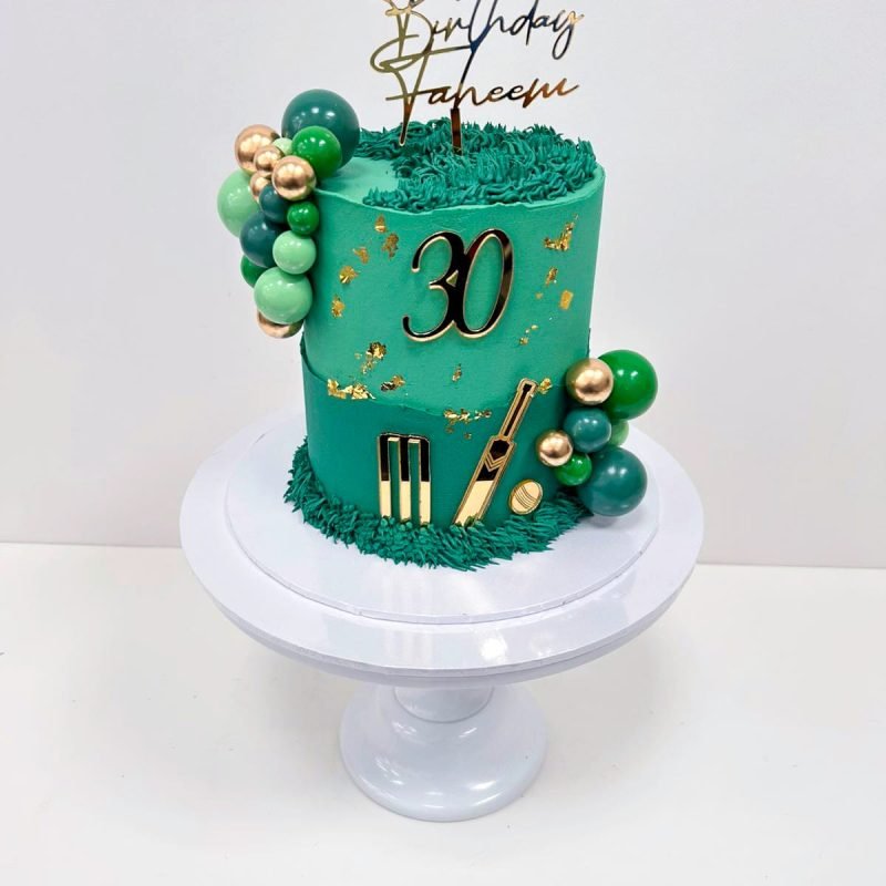 Cricket Cake handmade in birmingham with buttercream pipping, non-edible balls and acrylic charms