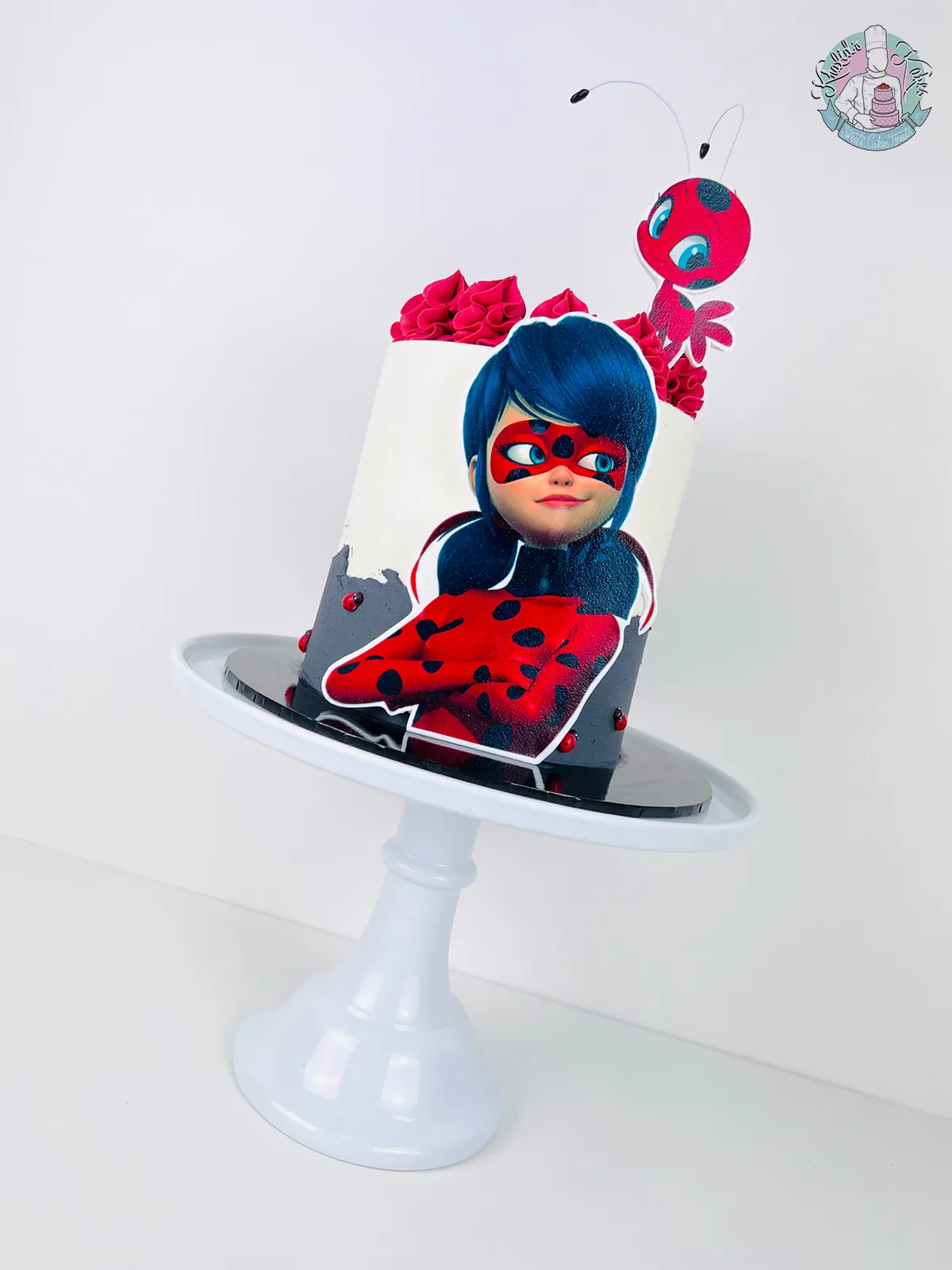 Miraculous Cake Birmingham — children’s birthday cake with bold red and black Ladybug spots.
