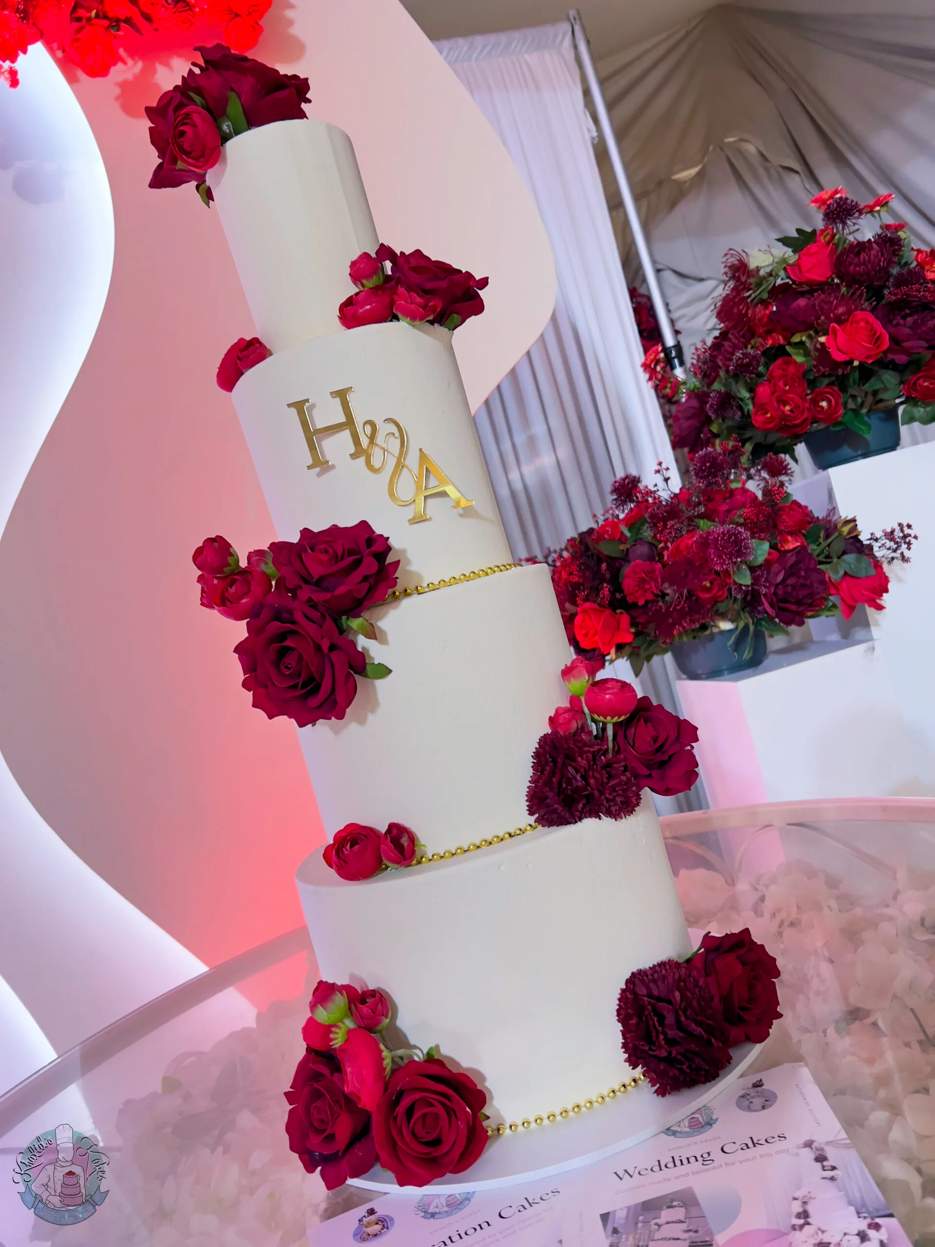 Smooth Wedding Cake Birmingham — clean tiered cake with a smooth finish, pearl ribbon and custom topper.
