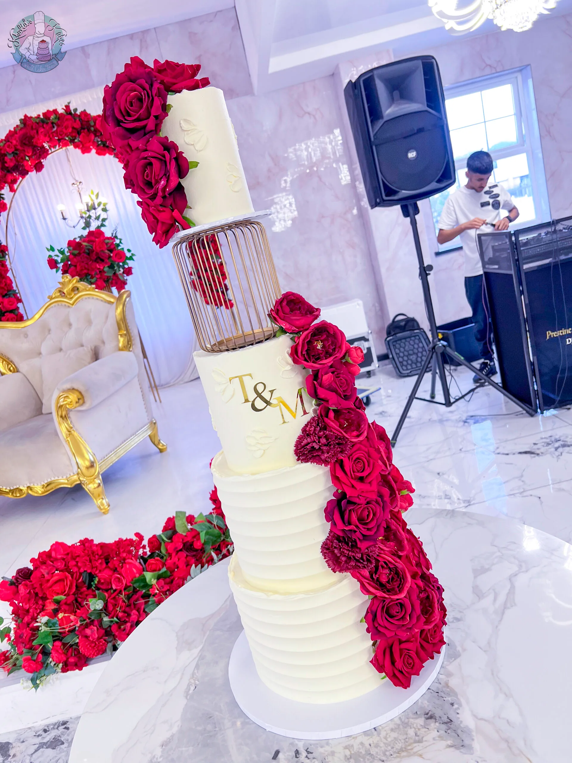 Cage Wedding Cake 2 Birmingham — tiered cake with a decorative cage feature and flower colour accents.