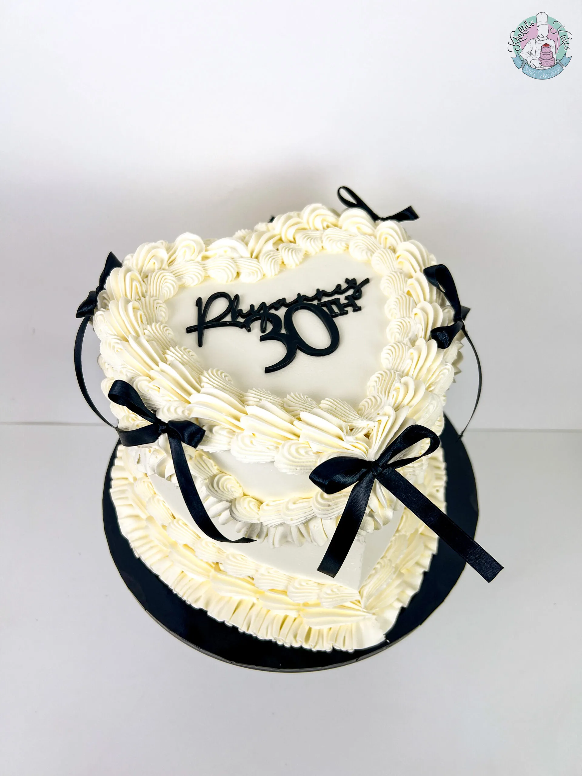 Bow Heart Cake Birmingham, an elegant heart-shaped cake with a bow, handmade by Khalids Kakes
