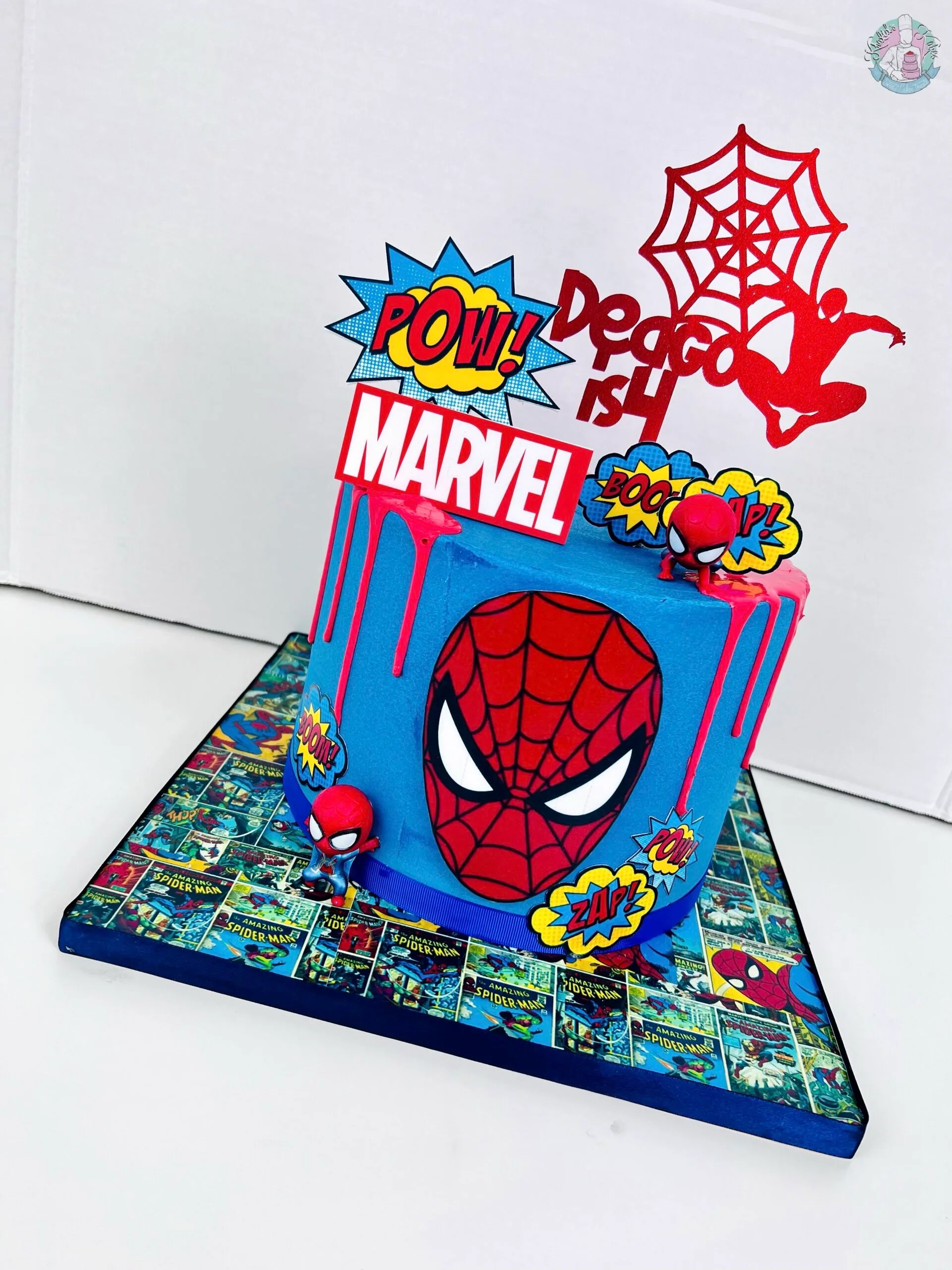 Spiderman Cake Birmingham — children’s birthday cake in bold comic-book red and blue with webs.