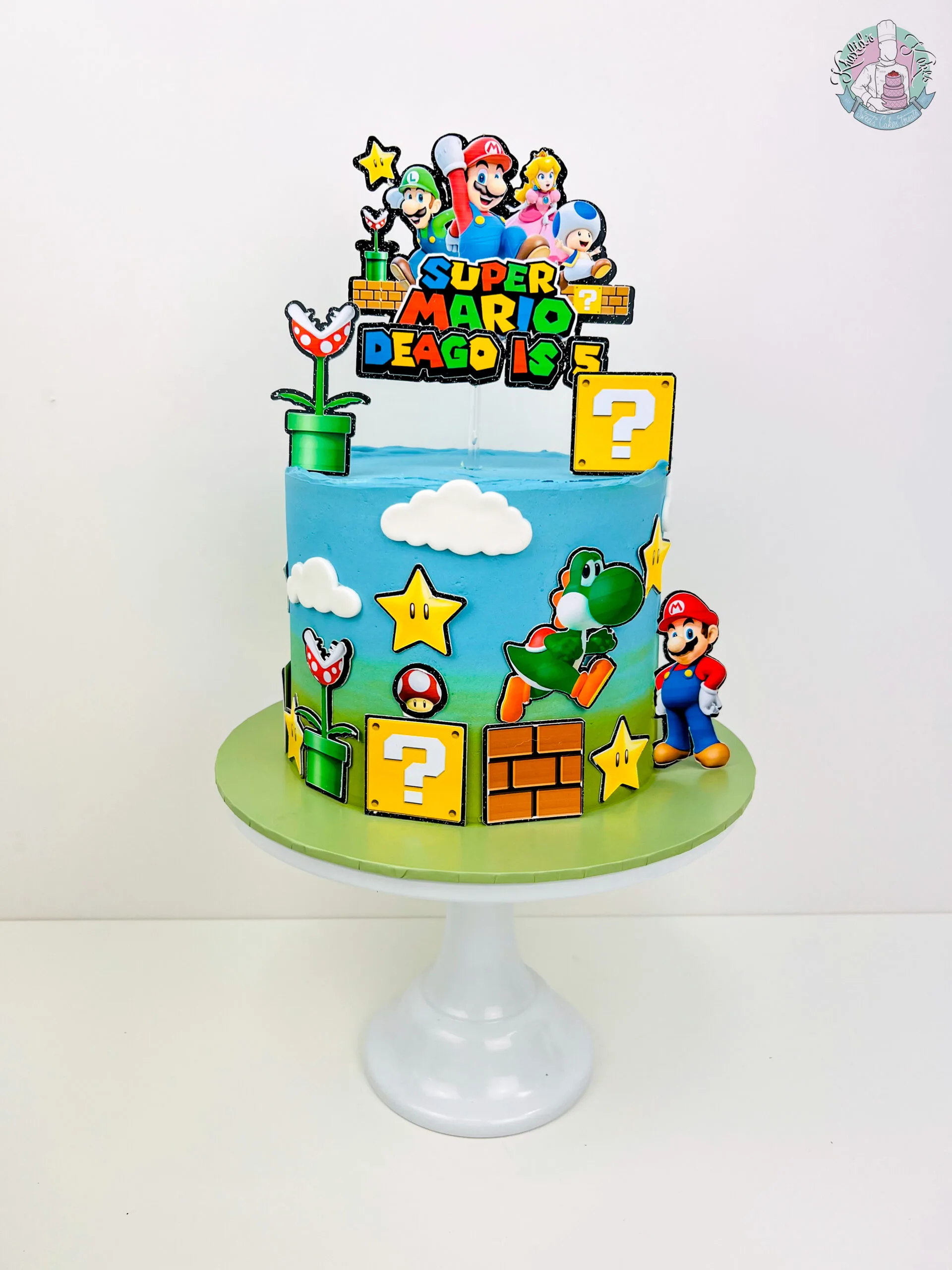 Super Mario Cake Birmingham — children’s birthday cake with question blocks, coins and a mushroom.