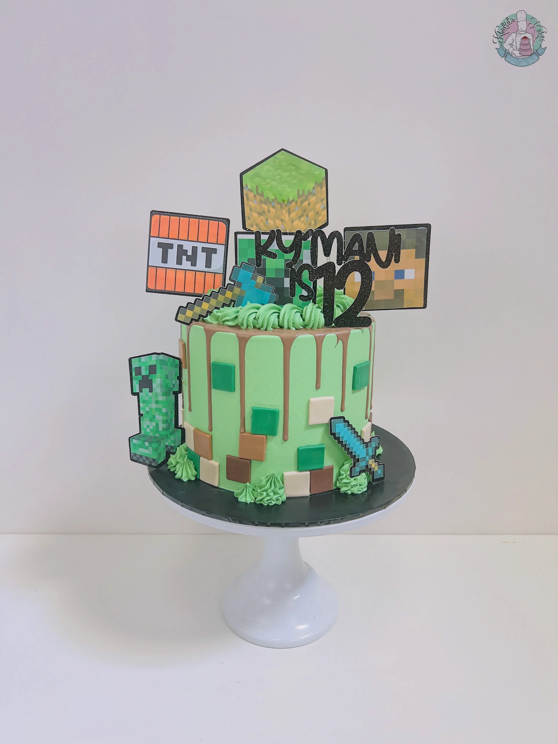 Minecraft Cake Birmingham — children’s birthday cake with grass blocks and creepers.